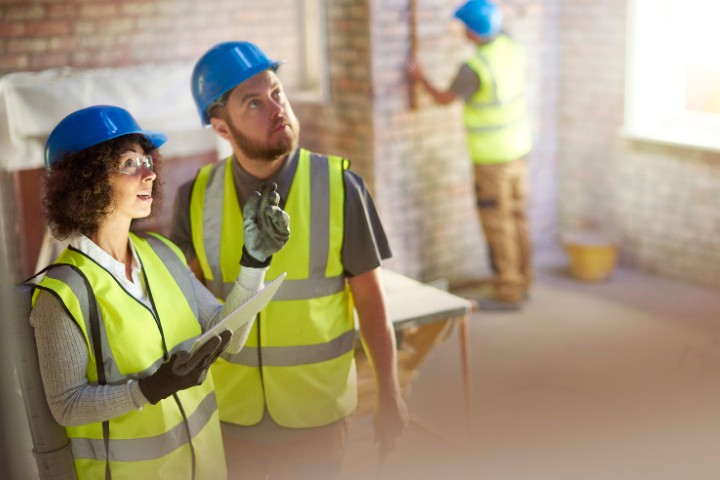 contractor and client checking construction site