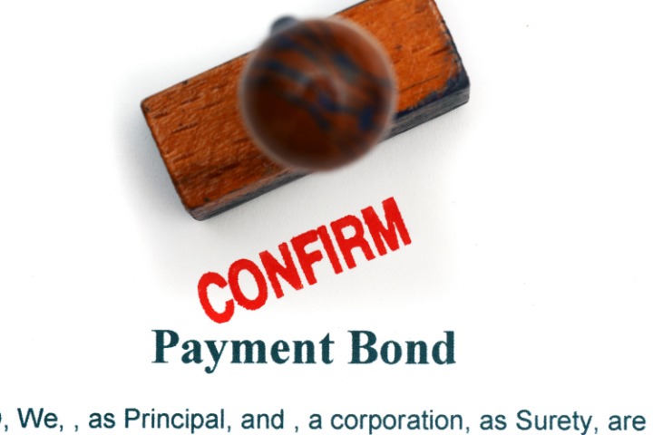 Payment bond document stamped with 'Confirm,' indicating validation of financial security for a construction project