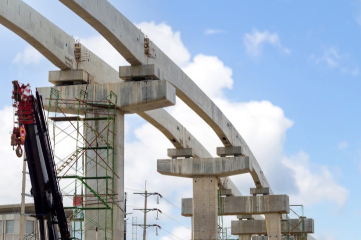 Cranes and scaffolding at an elevated railway construction site